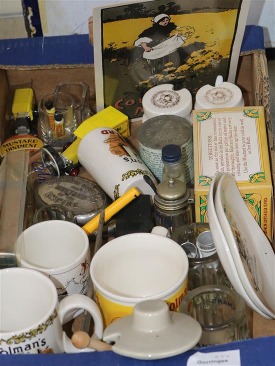 A collection of Colmans mustard and other ceramic and glass mugs etc